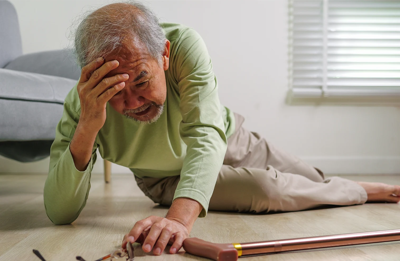 man on the ground after falling at home