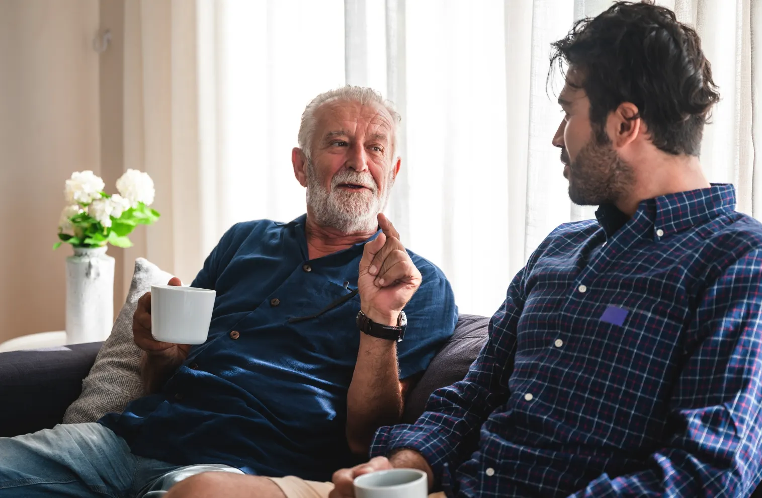 senior father and son relaxing and talking